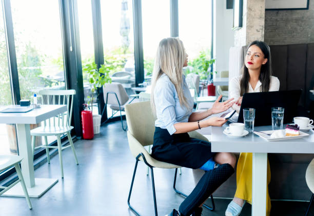istock Contemporary Young Women Working in Cafe  Indoor 1337015204
