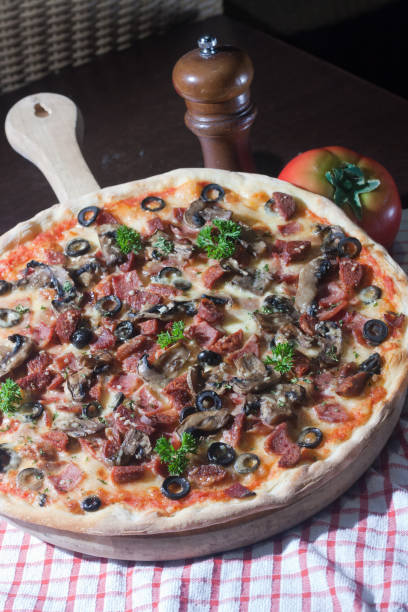 istock Meat pizza with sliced meat and mushroom 1337021310