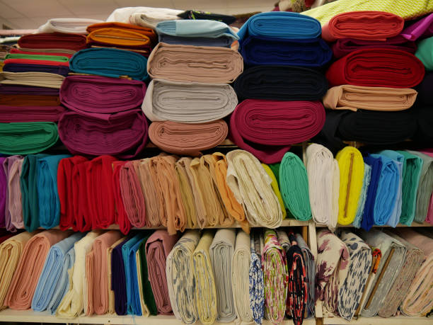 istock Rolled fabrics. Showcase of multi-colored samples of natural fabrics. 1337024573