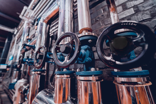 istock The valves and pipes at a craft modern brewery wall 1337027971