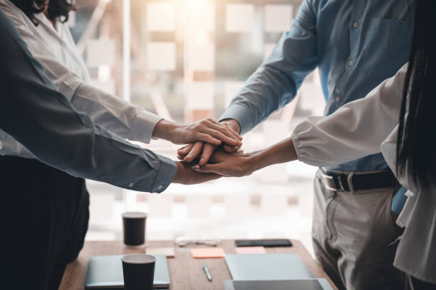 istock Group of business people with unity working together as a team. Teamwork together concept. 1337028680