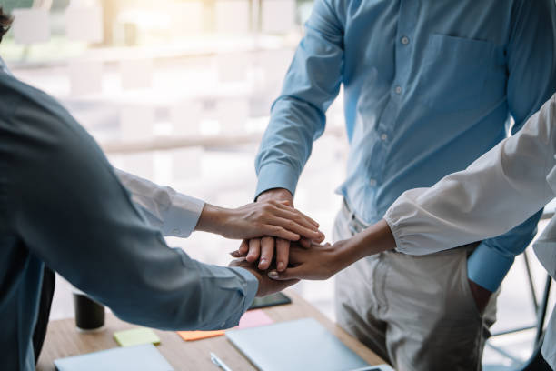 istock Group of business people with unity working together as a team. Teamwork together concept. 1337028681