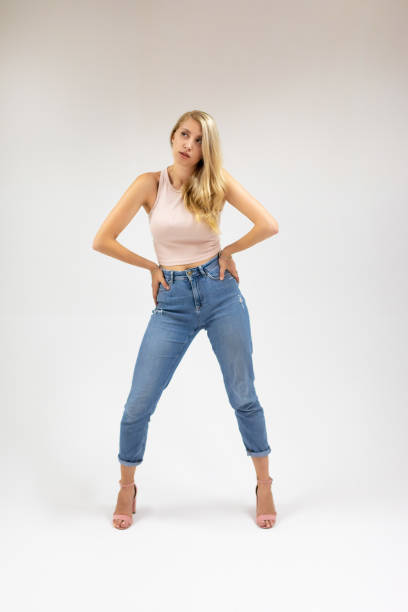 istock Beautiful young blonde woman is posing on white background 1337029702