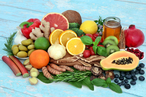 Health Food for Immune System Support Health food for immune system support with vegetables, fruit, honey, herbs and spice. Health foods very high in antioxidants, anthocayanins, protein, fibre, vitamins, lycopene, minerals and omega 3. micronutrients stock pictures, royalty-free photos & images