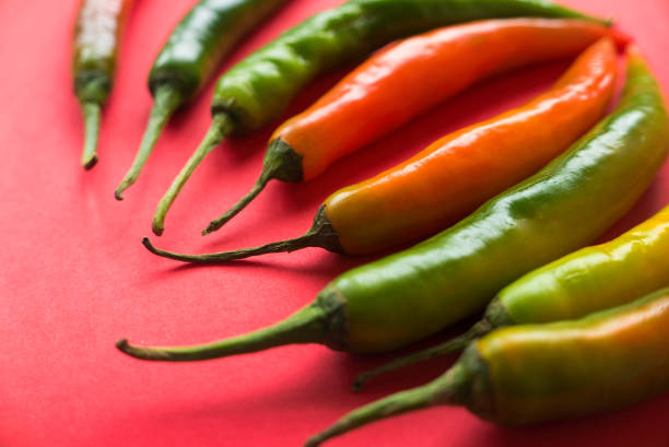 istock Chili pepper on a red background. 1337037251