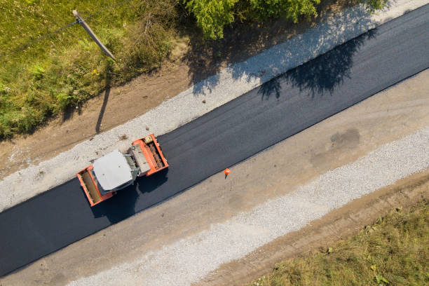 istock Aerial view of new road construction with steam roller machine at work. 1337037262