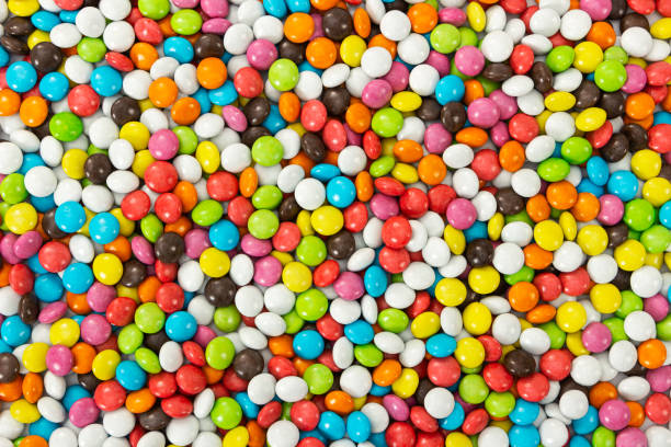 sweet colorfull candy dragee as background - candy coated imagens e fotografias de stock