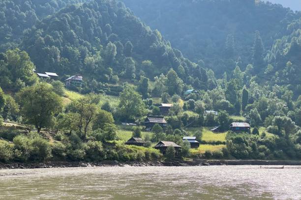 istock Beautiful view of village on river side 1337040202