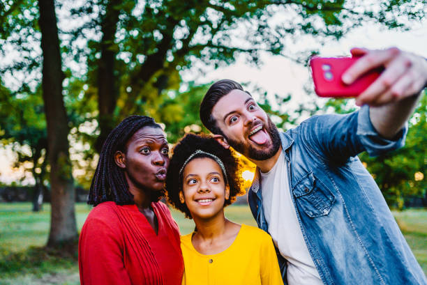 istock Happy family making selfies 1337043947