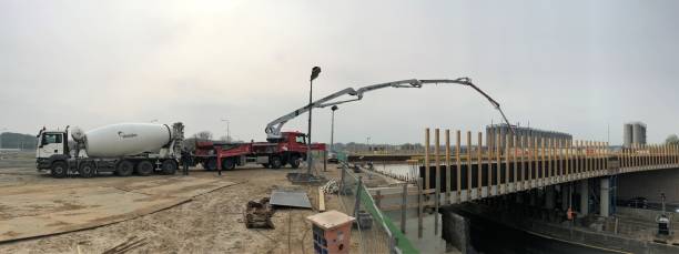 pouring concrete for a new bridge - truck motion road cement truck imagens e fotografias de stock