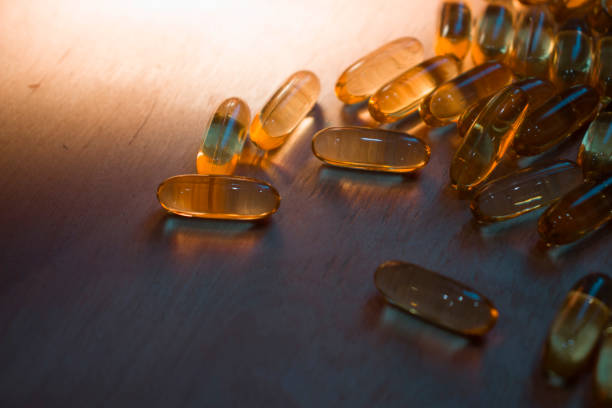 istock capsules on a wooden table 1337045777