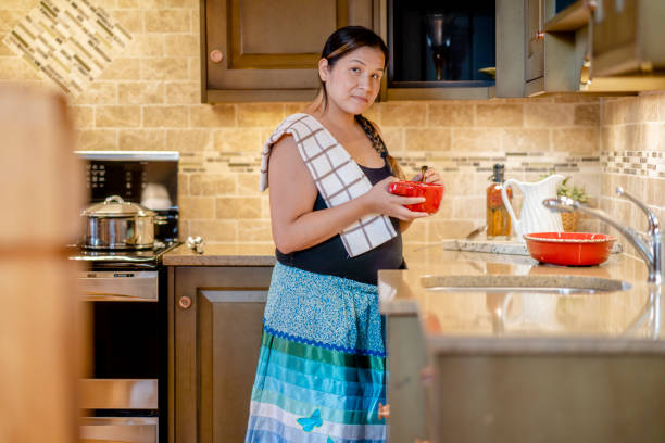 istock Young Indigenous woman cooking at home 1337046824
