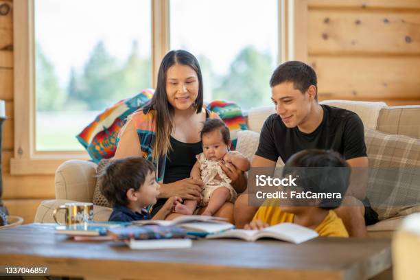 Young Indigenous Canadian Family Spending Time Together At Home Stock Photo - Download Image Now
