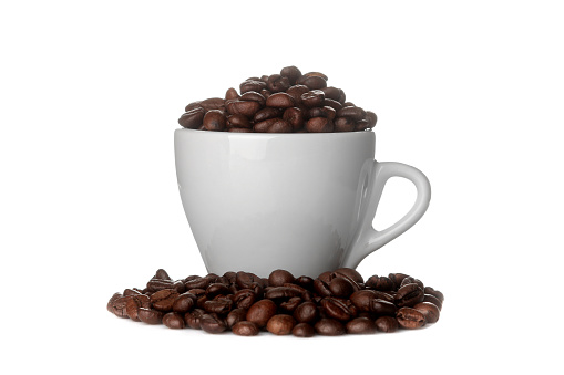 coffee beans in a white cup on a white isolated background