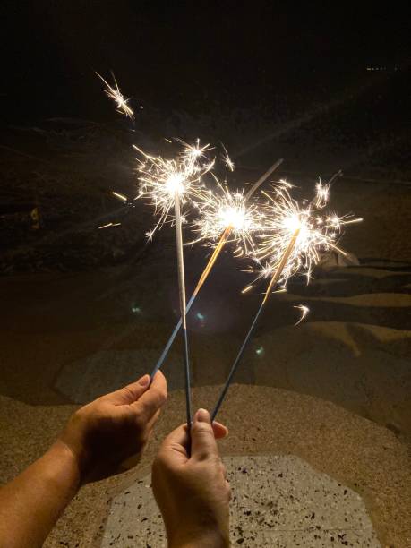 istock Handheld fireworks on the beach in the summer 1337049384