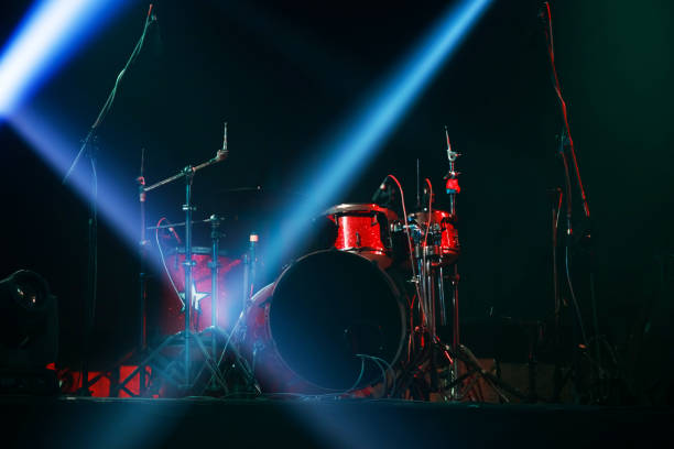 istock Red drum set ready for concert on stage 1337053732