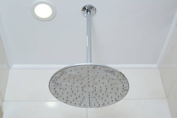 istock shower head on the wall in the hotel bathroom 1337053739
