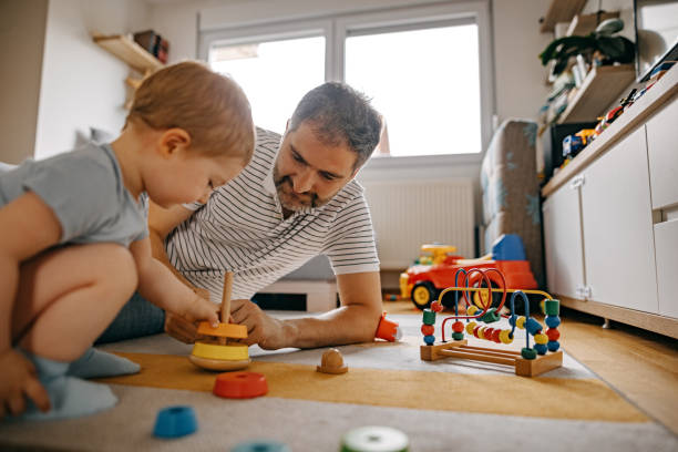 istock Father and son play together 1337054399