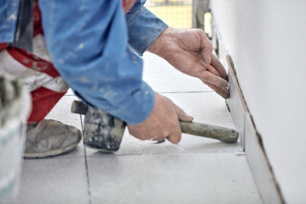 istock Ceramics tile man worker placing new tiles on the floor and wall. 1337056006