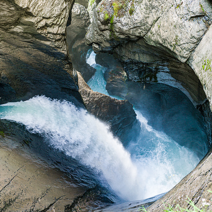 Close up of waterfall flowing over rocks into freshwater. Photographed in Tropical North Queensland, Australia.