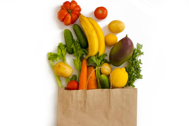 istock paper bag, vegetables and fruits on a white background 1337059073