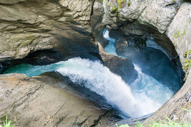 trummelbach waterfall in lautenbrunnen. a glacier waterfall system located inside the mountain with narrow paths and picturesque views. - mountain drop europe switzerland imagens e fotografias de stock