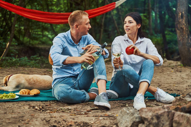 istock Happy couple enjoying romantic time in forest 1337061069