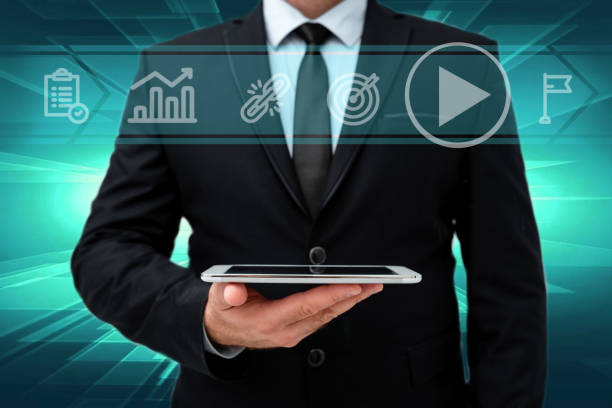 istock Man In Office Uniform Standing Holding Tablet Displaying New Modern Technology. Gentleman In Business Attire Carrying Tab Pointing New Futuristic Technology. 1337061151
