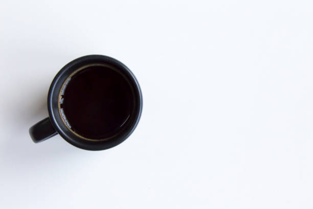 istock Black coffee on white background, view from above. 1337062752