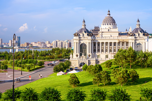 Kazan in summer, Tatarstan, Russia. Scenic view of Farmers Palace (Ministry of Environment and Agriculture) and beautiful green park in Kazan city center. This place is landmark of Kazan.