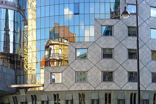 Images with abstract background of the reflection effect of the facade of a building by its shape