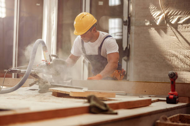 istock Male worker using wood cutting circular saw machine in workshop 1337068314