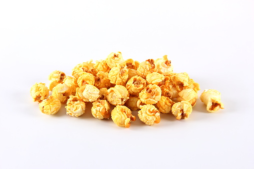 Heap of popcorn on white background