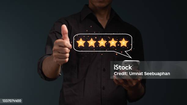 The Concept Is Customer Satisfaction The Businessmans Hand With Thumb Up Positive Emotion Five Stars In Balloon Massage Stock Photo - Download Image Now