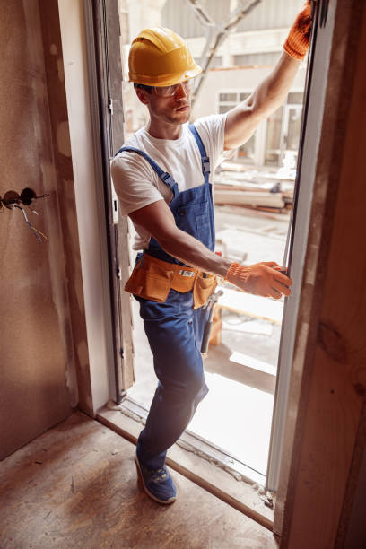 istock Male builder measuring inside edge of door frame 1337074548