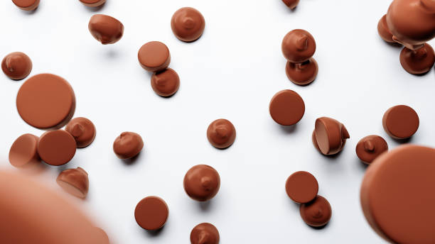 istock Chocolate Chips falling on isolated white floor chocolate piece morsels or drops spread 1337078064
