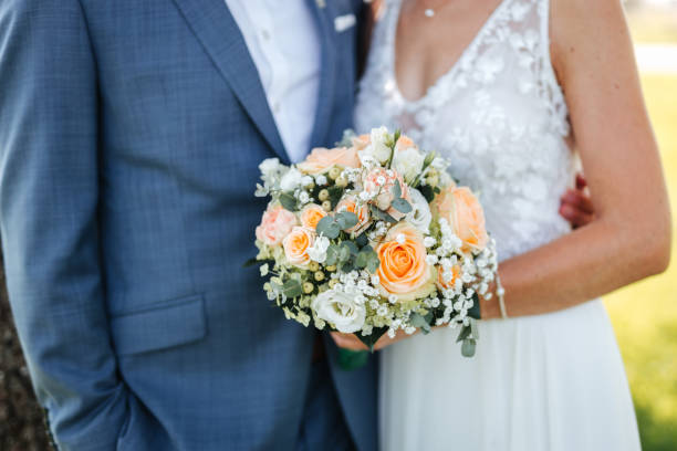istock Bride holding beautiful wedding bouquet in her hands close-up 1337080678
