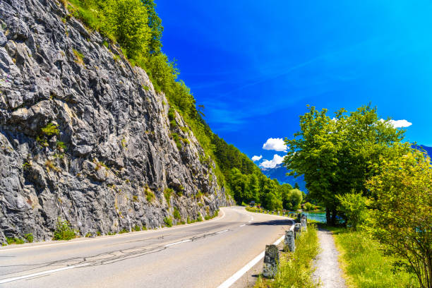 istock Road with cliffs, Lake Thun, Thunersee, Bern, Switzerland 1337080874