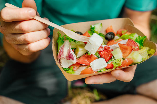 istock Vegetable salad in the brown kraft paper food container 1337083401