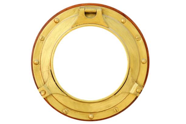 istock Round golden brass boat window isolated 1337084958