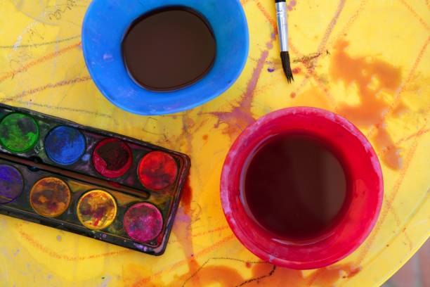 istock Children messy dirty student watercolor table 1337085022