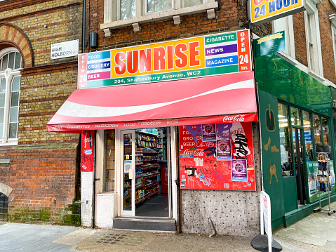 Sunrise Convenience Store on Shaftesbury Avenue in Covent Garden, London, with commercial signs visible