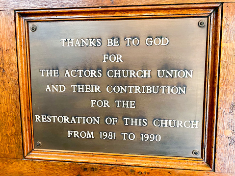 A plaque inside The Actors' Church of St Paul in Covent Garden, London which explains that the Actors Church Union contributed to the restoration from 1981-1990.