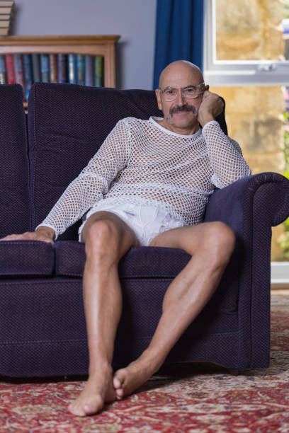 istock Senior gay man relaxing in his study 1337086645