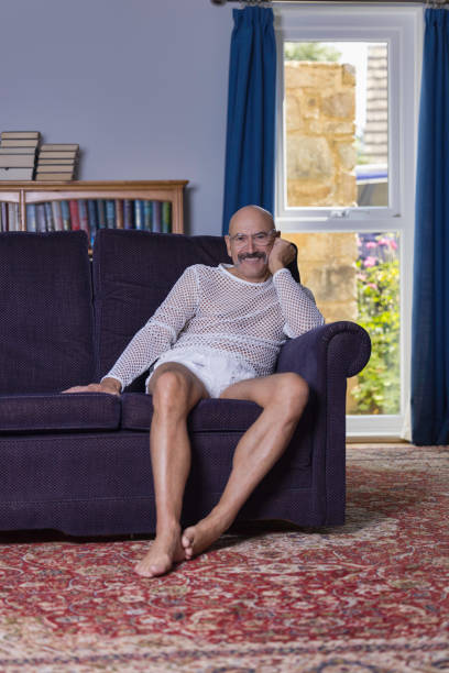 istock Senior gay man relaxing in his study 1337086722