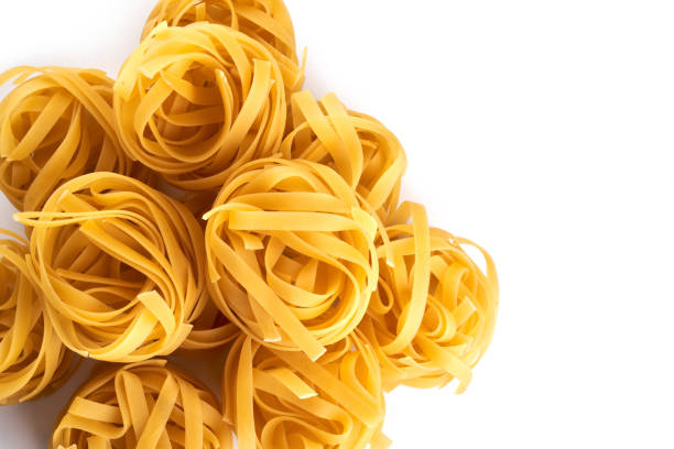 istock pasta wallpaper. macaroni, spaghetti on white background with copy space 1337087041