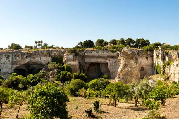 Photo of Natural Sceneries of The Latomia del Paradiso in The Neapolis Archaeological Park in Syracuse, Sicily, Italy.