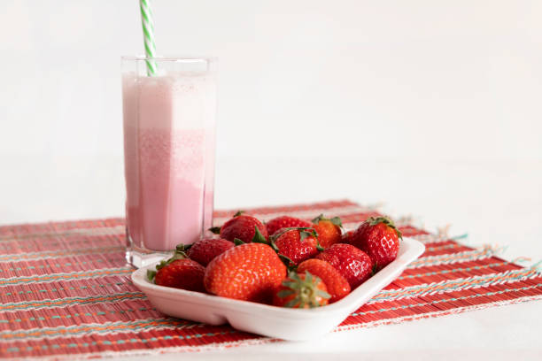 Delicious strawberry milkshake decorated with whipped cream