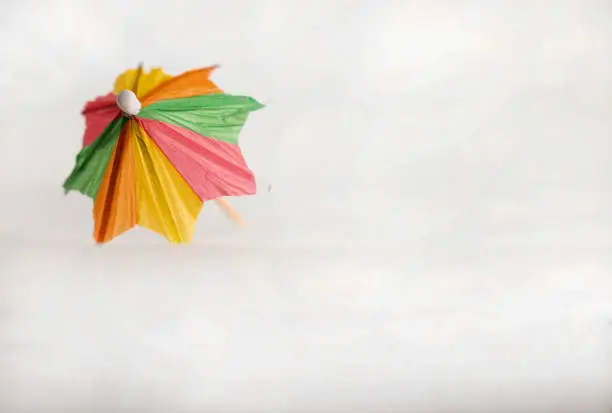 Photo of colored umbrella supported and open