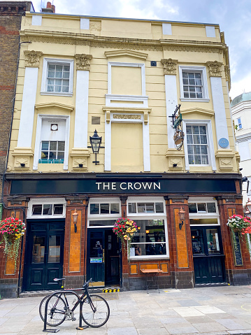 Diners can be seen in The Crown Pub on Monmouth Street in Seven Dials, London. It was established in 1833.